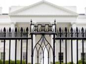 A driver has died after crashing a vehicle into a gate at the White House, authorities say. (AP PHOTO)
