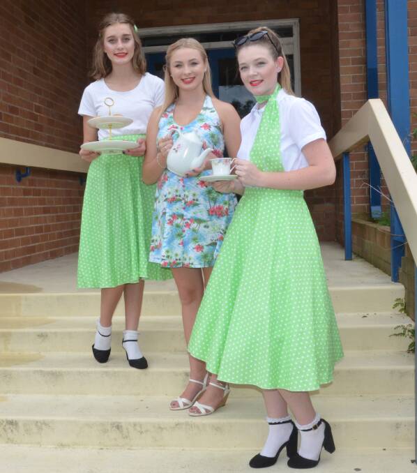 RETRO: Kurri Kurri High School students Ebony Keeley, Micaela Page and Chloe Musgrave are gearing up for the Nostalgia Festival high tea on Friday. Picture: Krystal Sellars