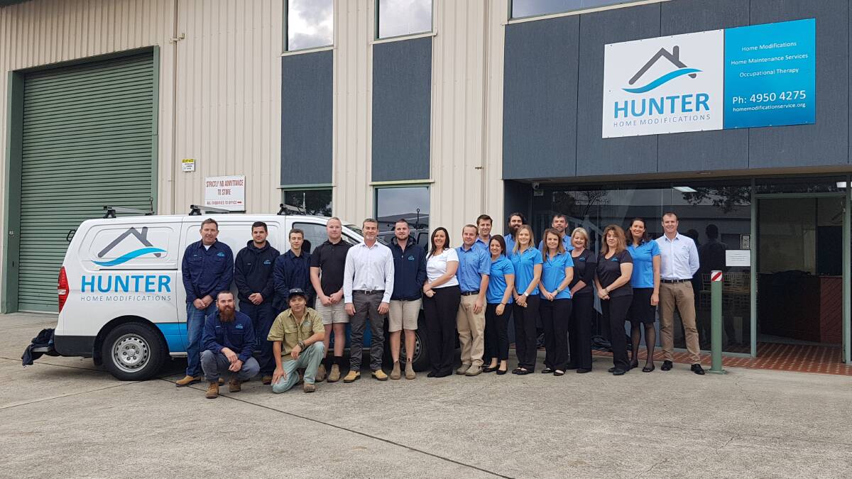 FROM HUMBLE BEGINNINGS: Proud staff at Hunter Home Modifications pose out front of their new premises at 6 Pennant Street, Cardiff.