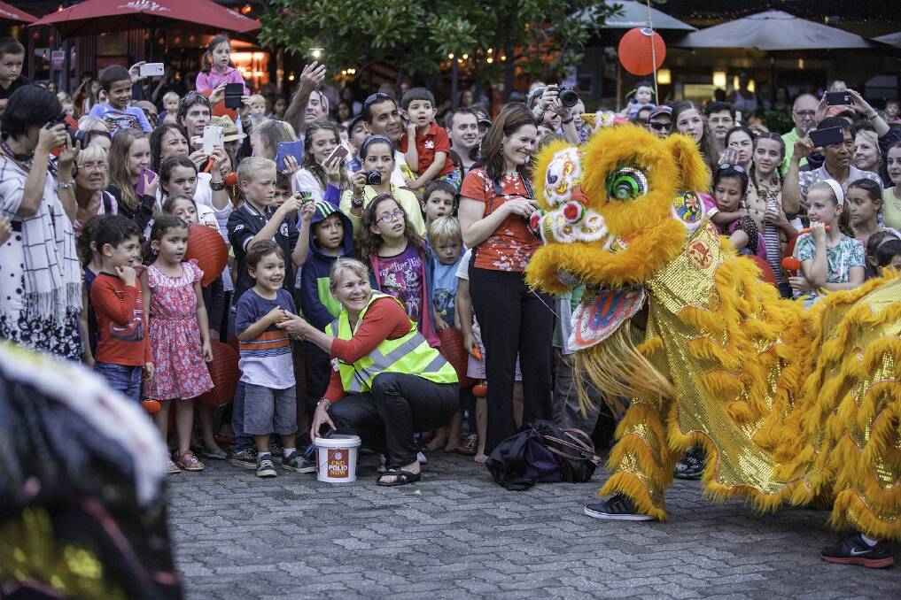 Festive: Revellers celebrate the Chinese New Year at the inaugural Light Up Newcastle Lantern Walk at Honeysuckle.