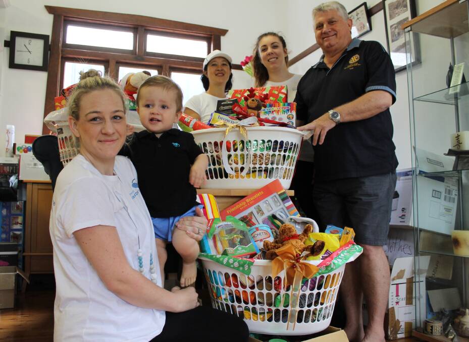 Generous: Newcastle Basket Brigade volunteers Catherine Hartley, her son Cooper, 1, Michelle Lee, Claire Jordan and Tom Burgess.