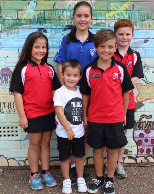Family tree: Edgeworth Public School current and former students Kyah Hodges, Kobi Hodges, Eryn Griffiths, Noah Hodges and Cooper Griffiths. Pictures: Georgia Osland