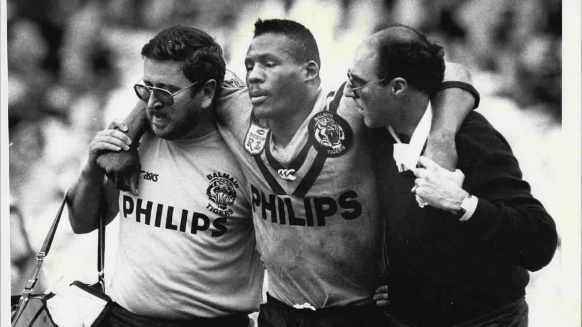 FAMOUS MOMENT: Balmain's Ellery Hanley is helped from the field in the 1988 grand final after a high tackle from Terry Lamb.