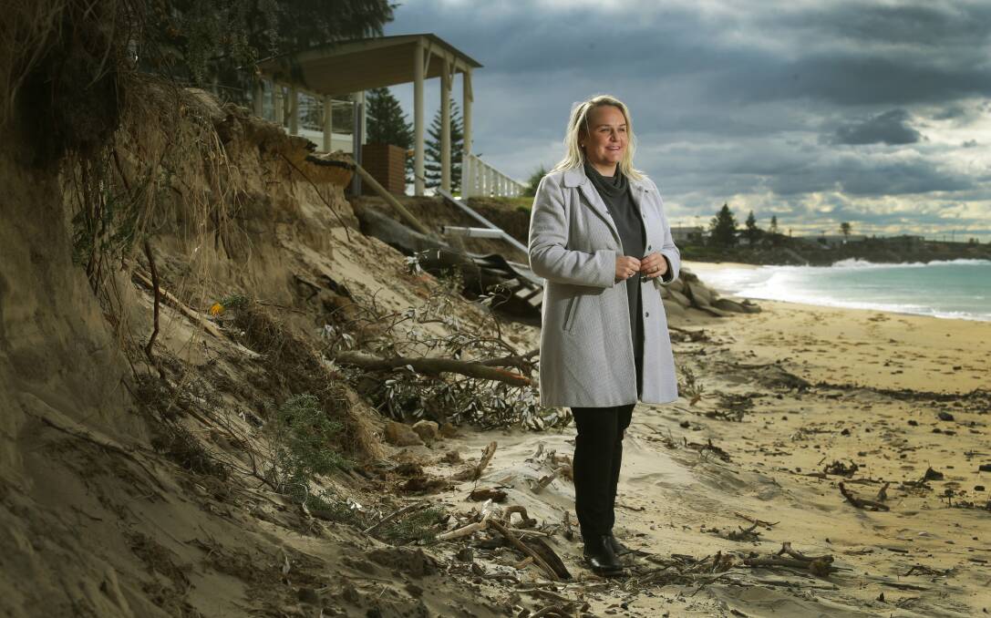 WIN-WIN: Lord Mayor Nuatali Nelmes surveys beach erosion at Stockton resulting from recent storms and huge swells. Picture: Marina Neil