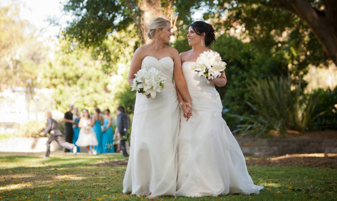 BLISS: Erin and Renee Harris held a civil ceremony at the Crowne Plaza five years ago but hope to make their marriage legally-binding.