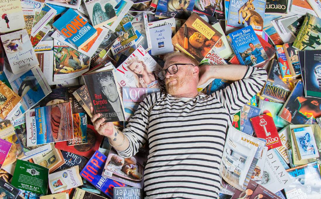 In print: Lifeline Hunter and Central Coast retail manager Jason Fox takes a reading break. For the past five years, Bookfest fundraised for Hunter Lifeline, it has sold more than 60,000 books and raised about $120,000.