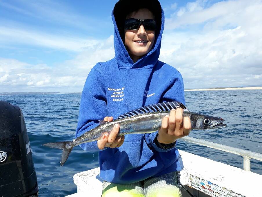 BAD EATING: Ryan Judd, 13, holds a southern barracouta which is known for being filled with bones from head to tail. 