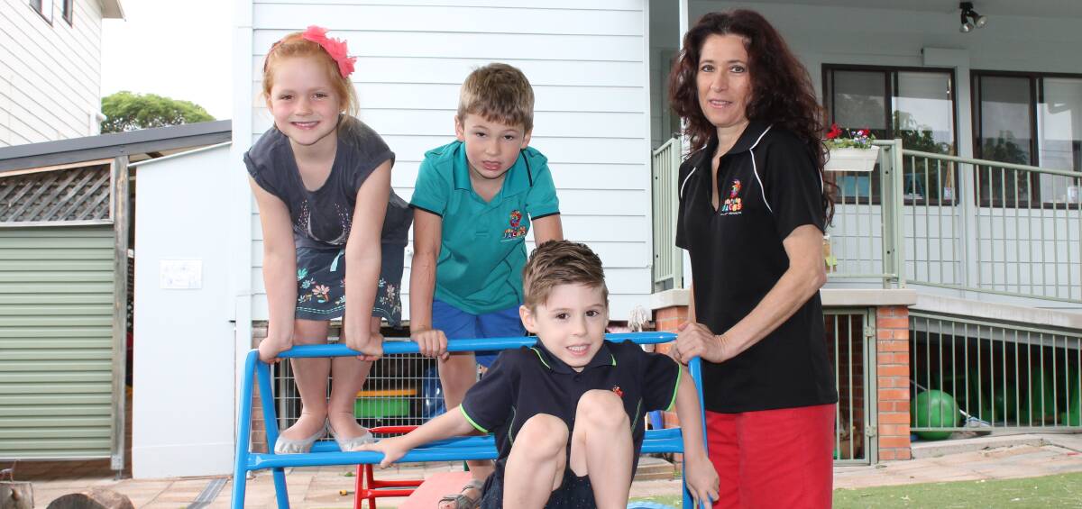 FUNDS WORRY: Jumping Jacks Community Preschool director Rina Laudadio is pictured with five-year-olds Grace Betland, Dante Stojanovski and Harry Bell. Picture: Anna Wolf 