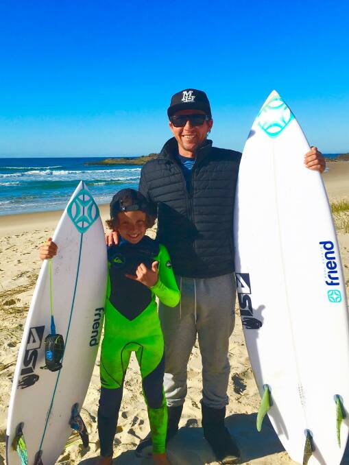 SURFING FAMILY: Chris Hasson with his son, Eden. Picture: Chris Hasson.