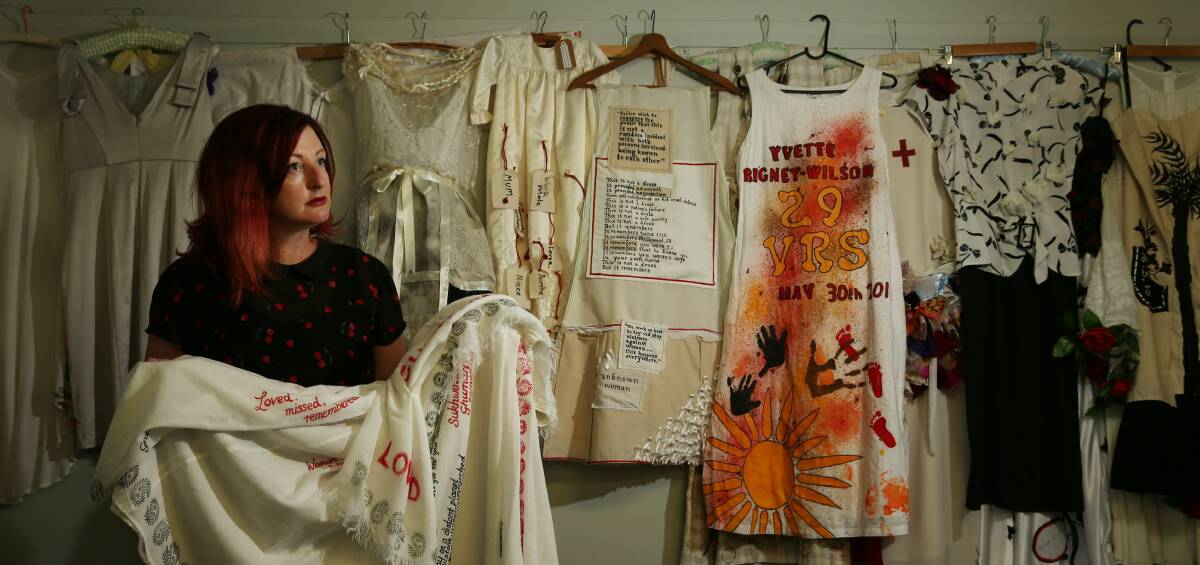 LOVED, MISSED, REMEMBERED: Fiona Whitton holds one of the garments made for the 67 women who have died from violence this year. Picture: Simone De Peak