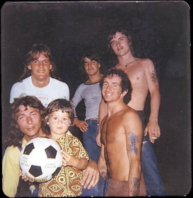 HELLS BELLS: Zeke Marosszeky pictured with members of AC/DC. 