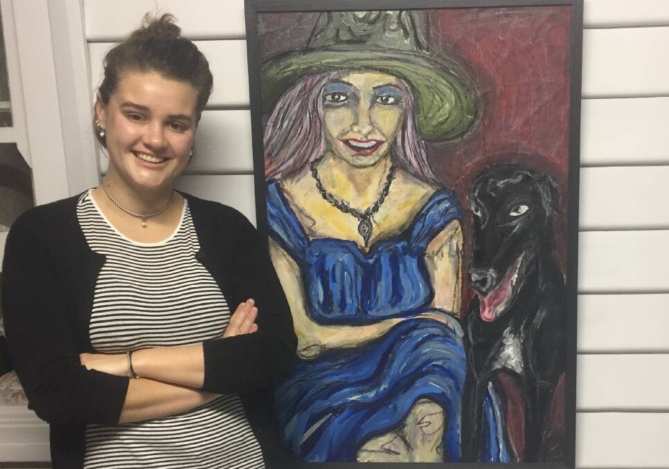 CHAMPIONS: Artist Erika Elizabeth Sorby pictured with her portrait of Sonia Hornery and greyhound Ollie. 
