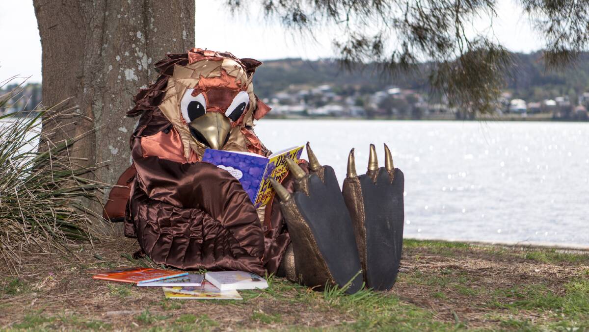 CHILDREN'S WEEK: Lake Macquarie’s reading eagle Kora encourages families to read, rhyme, sing and dance so young children will be ready for reading and writing when they start school.