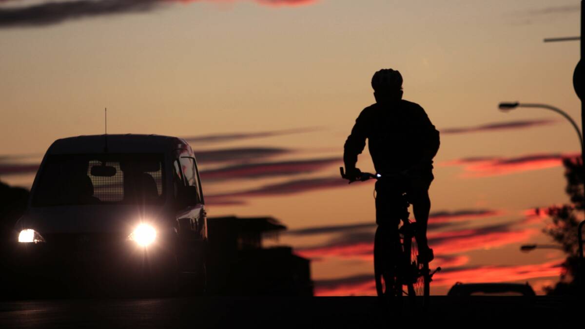 I WANT TO RIDE MY BICYCLE:  A cyclist on King Street, Newcastle, rides on dusk. Critical Mass wants to see safe cycling prioritised. Picture: Darren Pateman