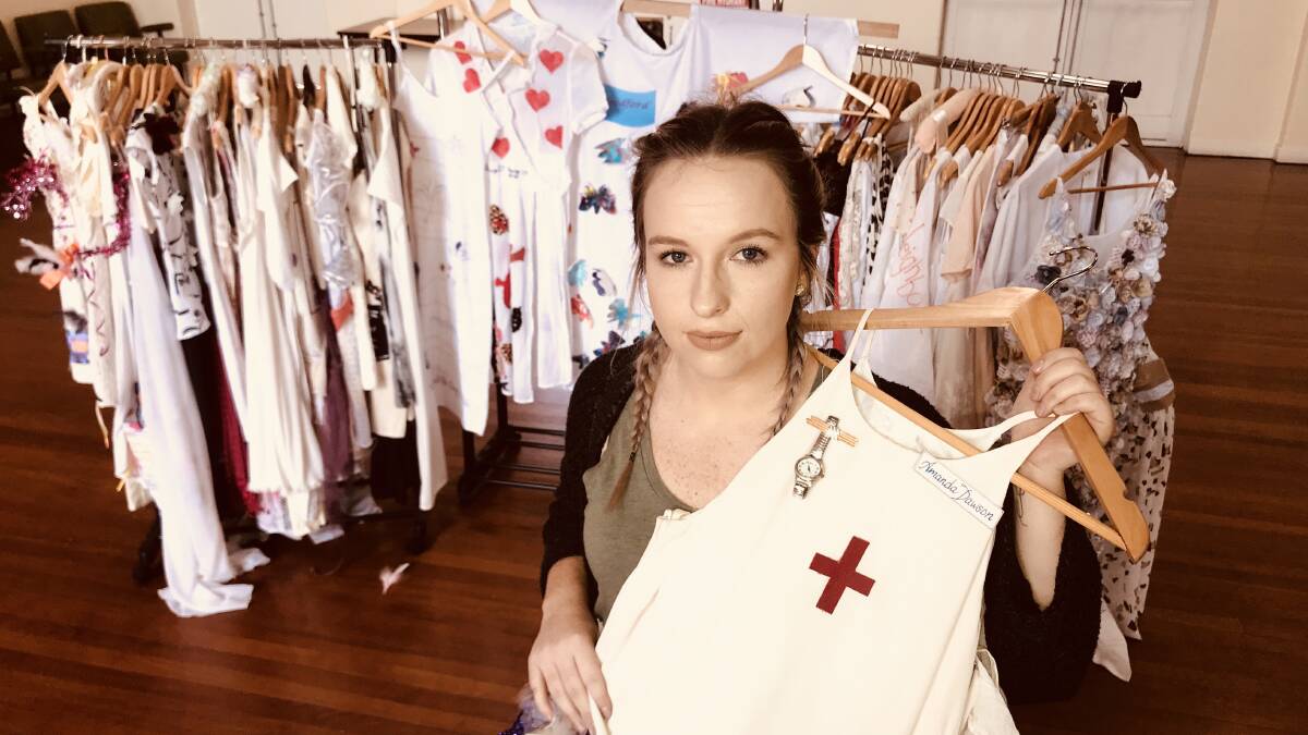 REMEMBERED: Brie Avery holds the dress made for mother and nurse Amanda Dawson who was murdered in Traralgon, Victoria, in October 2016. Picture: Melinda McMillan