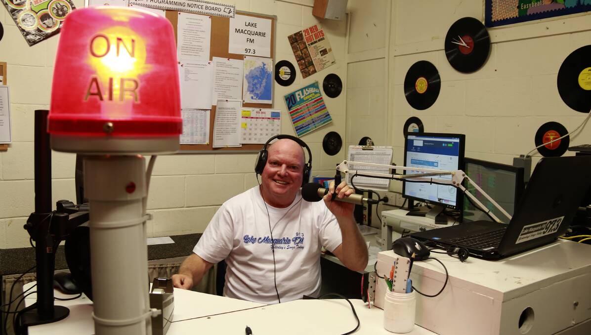 RADIO STAR: Wayne Osborne at the desk in the studio of Lake Macquarie FM 97.3, behind Halekulani Bowling Club. Picture: Michelle Attard