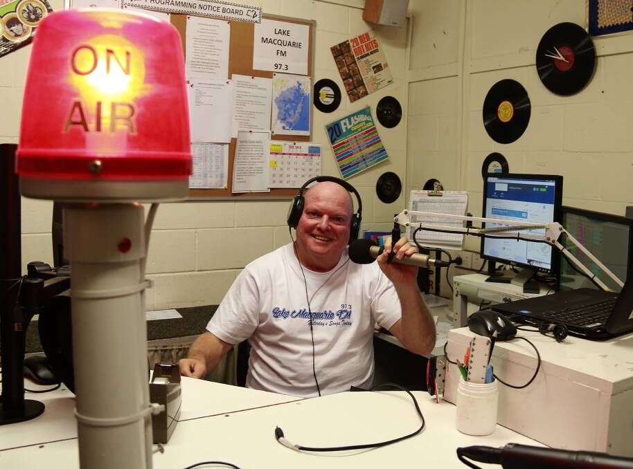 RADIO STAR: Wayne Osborne at the desk in the studio of Lake Macquarie FM 97.3. Picture: Michelle Attard
