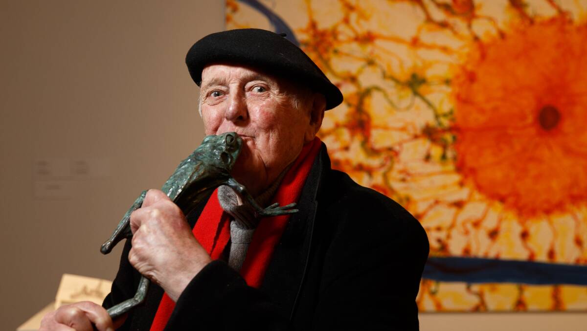 CITY'S SON: John Olsen kisses a bronze frog in Newcastle Art Gallery, where he donated new works, including the frog. 