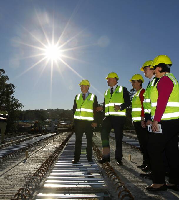DEVELOPMENT: Labor MPs and candidates inspect latest stage of the Glendale Interchange. Picture: Jonathan Carroll