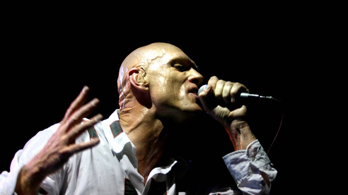 Photos from the archives of Midnight Oil on stage. 
