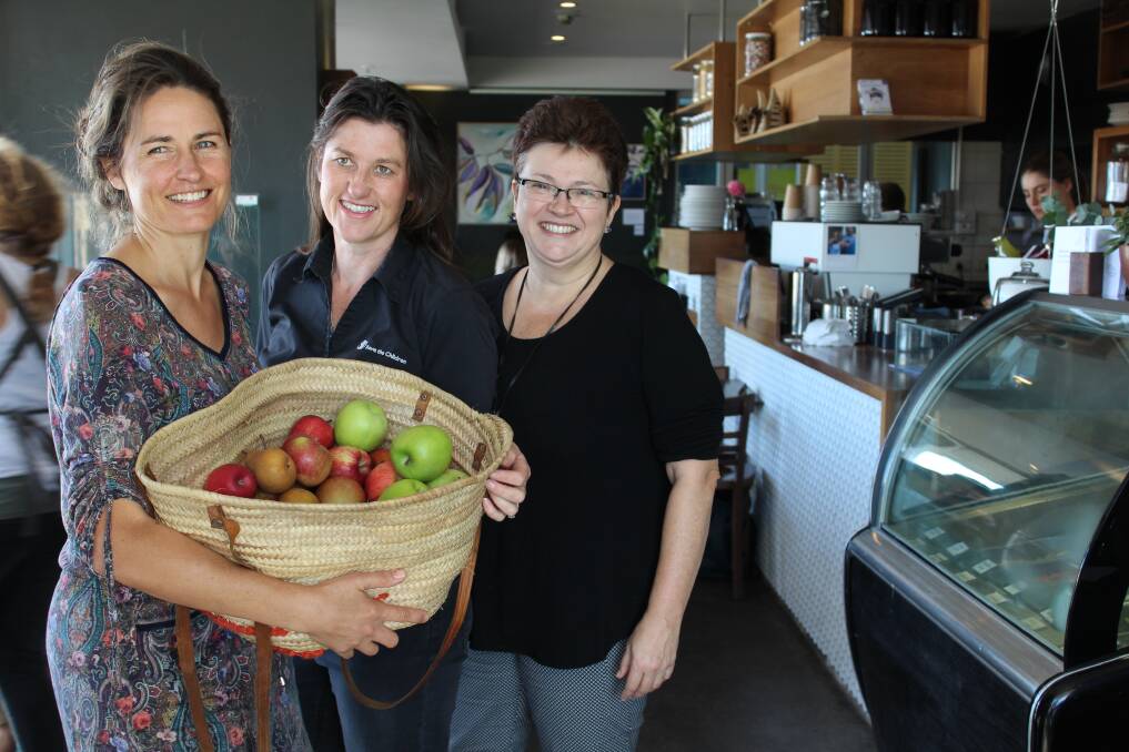 DOING HER BIT: Estabar owner Bec Bowie with her charity basket of fruit along with Save the Children's Sophie Gage and Jane Woolford.