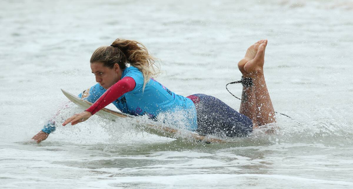 Philippa Anderon dives in for Merewether during the Australian Boardriders Battle finals at Newcastle beach over the weekend.