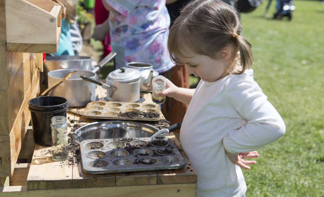 EXPLORING SENSES: The mud kitchen, which offers a fun and tactile experience, is always a big hit with the kids.
