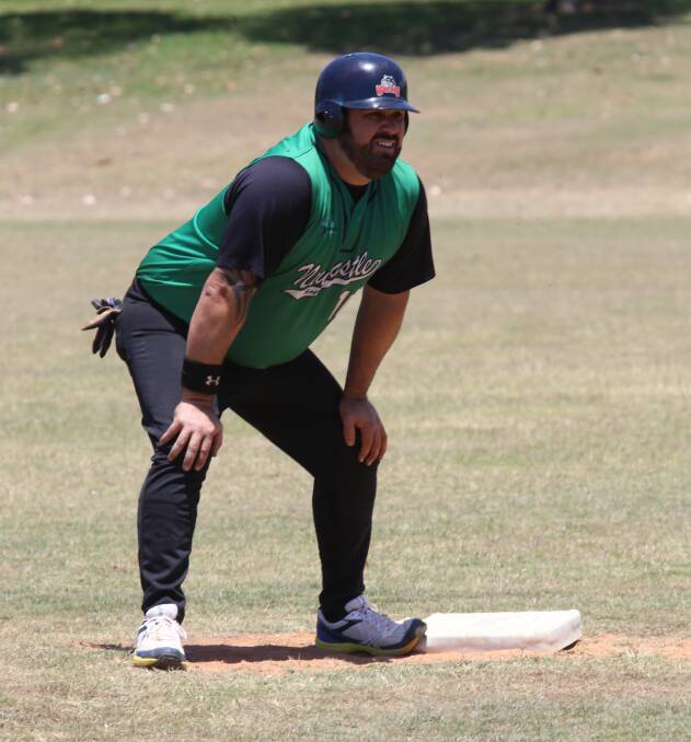 EXPERIENCE: Newcastle men's softball player Shane Carter waits to make a base run during the NSW men's softball championships over the weekend.