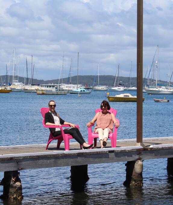 RELAXED: Lake Macquarie worker Elise Piper and Mayor Kay Fraser.