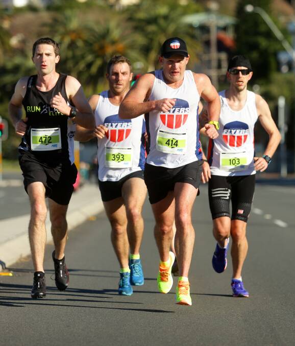 COMPETITIVE: A pack of runners sets a strong pace during the Lake Macquarie Running Festival held around the lake on Sunday. Picture: Jonathan Carroll