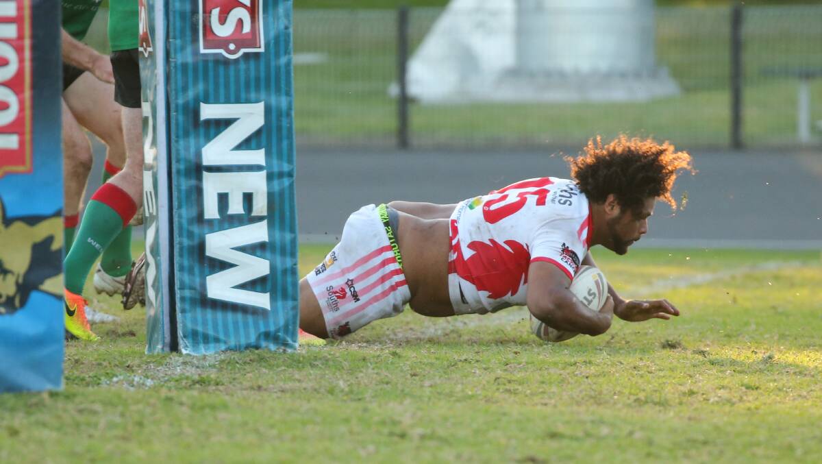 Souths' James Livock scores a try against Western Suburbs at Townson Oval.