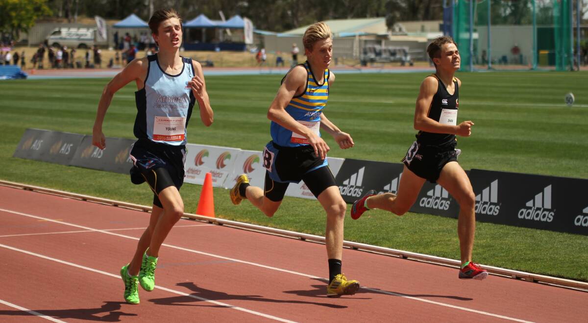 TIGHT: Toronto High School's Luke Young, left of shot, clinches a win in a nail-biting final of the under-16 boys' 800-metre final at the Australian All Schools Championships in Canberra. Picture: David Tarbotton