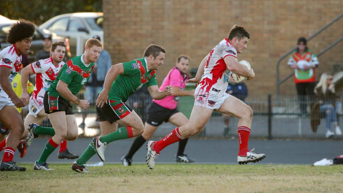 South Newcastle's Luke Higgins goes on the charge against Western Suburbs at Townson Oval.