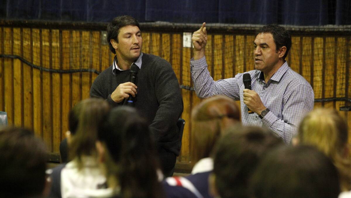LIVED EXPERIENCE: Former Parramatta Eels captain Nathan Hindmarsh, left, and former Newcastle Knights player Ashley Gordon talk to students about gambling awareness. Picture by Brock Perks.