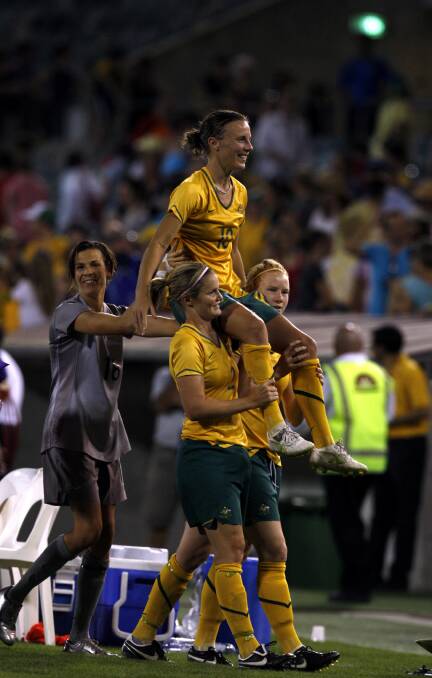 LEGEND: Joey Peters is chaired from the ground in her last appearance for the Matildas against Italy in Canberra in 2009. Picture: Glen McCurtayne