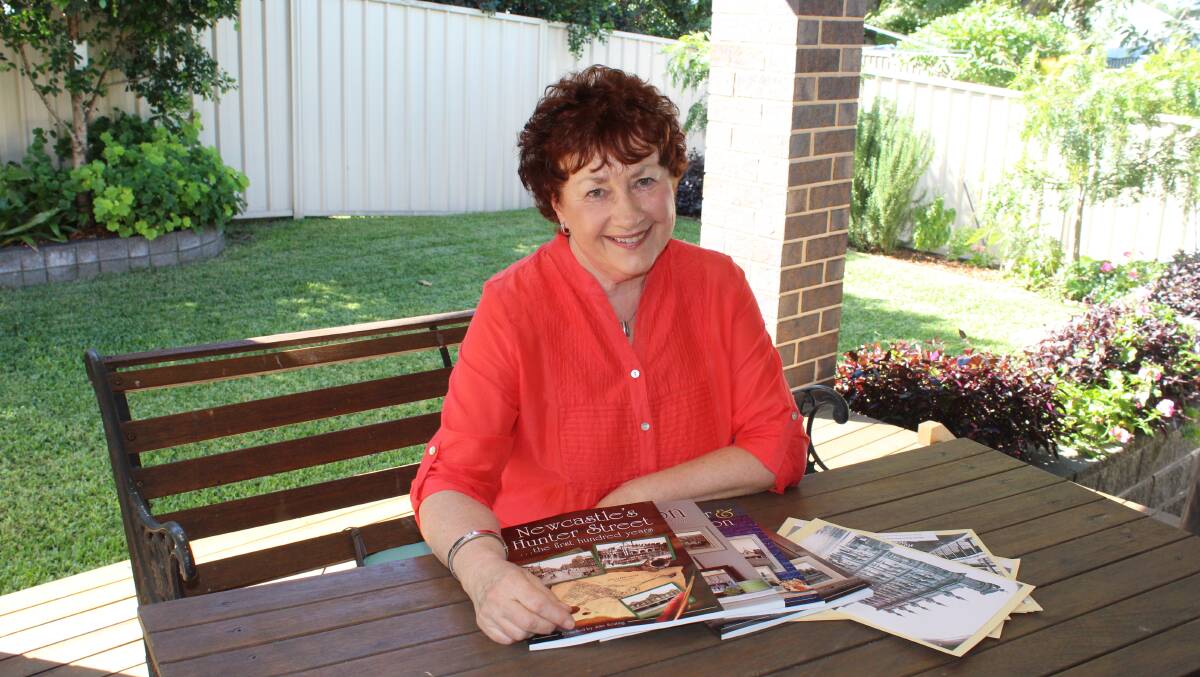 LOVE OF RESEARCH: North Lambton's Julie Keating with a collection of her self-published books of nineteenth century Newcastle, including her latest on Hunter Street.