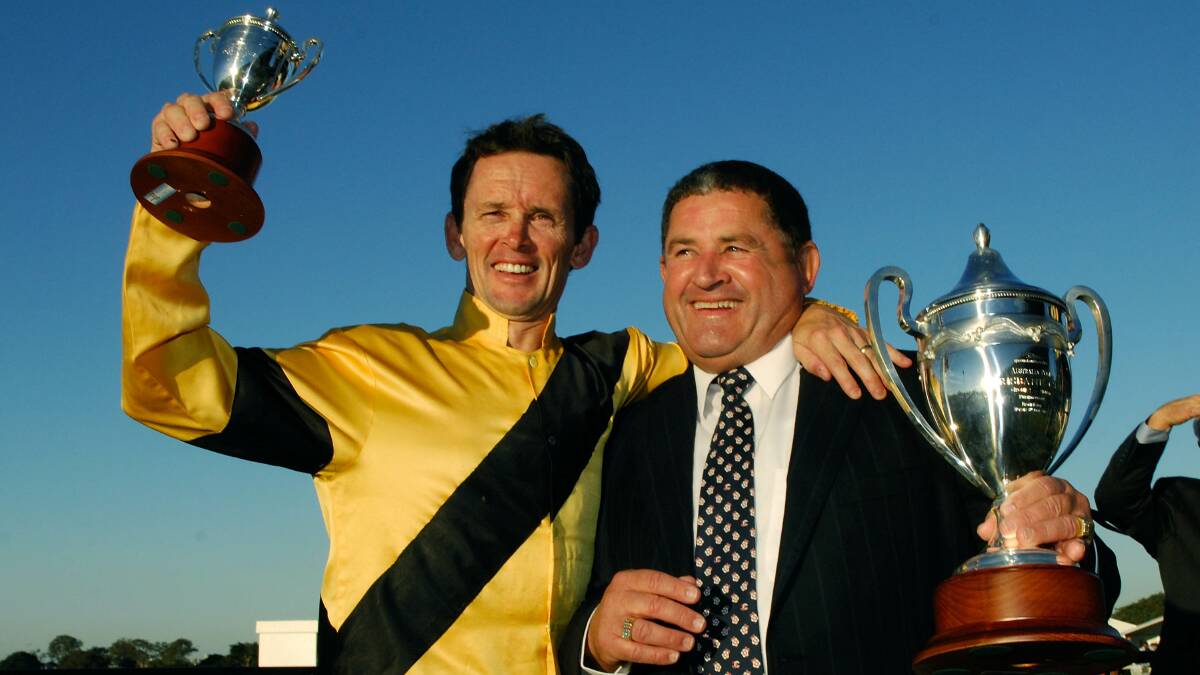 INDUCTEE: Newcastle trainer Paul Perry, right, pictured with jockey Allan Robinson, has been named as one of eight inaugural members into the Newcastle and Hunter Racing Hall of Fame.