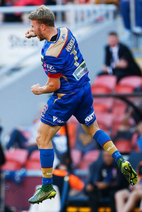 ON A HIGH: Andrew Hoole celebrates his opening goal in Newcastle's 3-2 win over Brisbane Roar at Suncorp Stadium on Saturday night. Picture: Getty Images