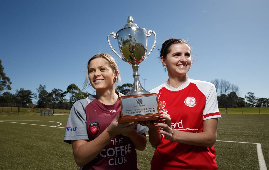 ON THE LINE: Warners Bay player-coach Cassidy Davis, left, and Merewether captain Lori Depcznski with the Herald Women's Premier League championship trophy ahead of Sunday's grand final at Edgeworth. Picture: Max Mason-Hubers
