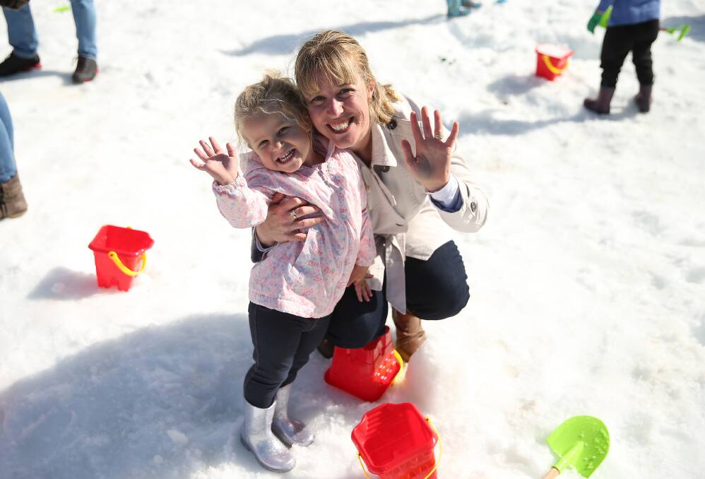 SNOW FUN: Emily Furner, 3, and Susan Furner of Kotara South enjoy Snow Time in The Garden at Hunter Valley Gardens. Picture: Marina Neil