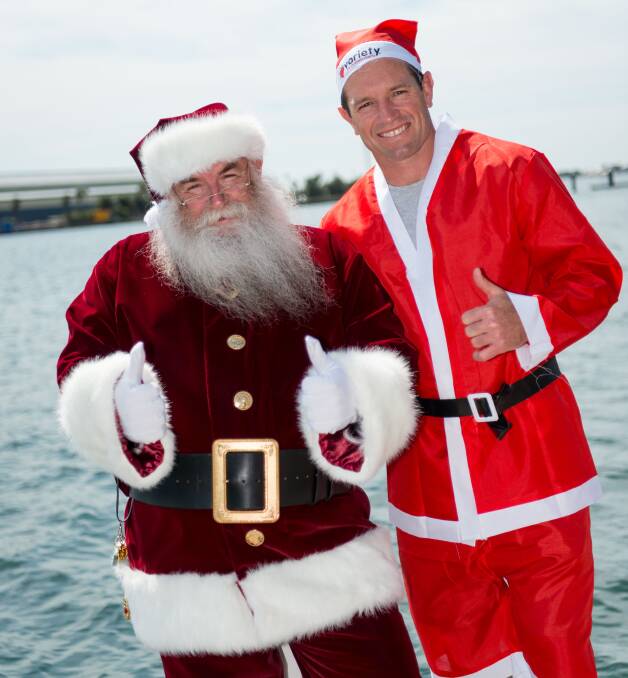 GOOD CAUSE: Former Newcastle Knights legend and Variety Santa Fun Run ambassador Danny Buderus with Santa.