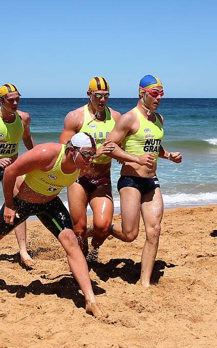 IMPROVING: Redhead surf-lifesaving competitor Daniel Collins, right, is eyeing a spot in the national ironman series final. Picture: Summer of Surf