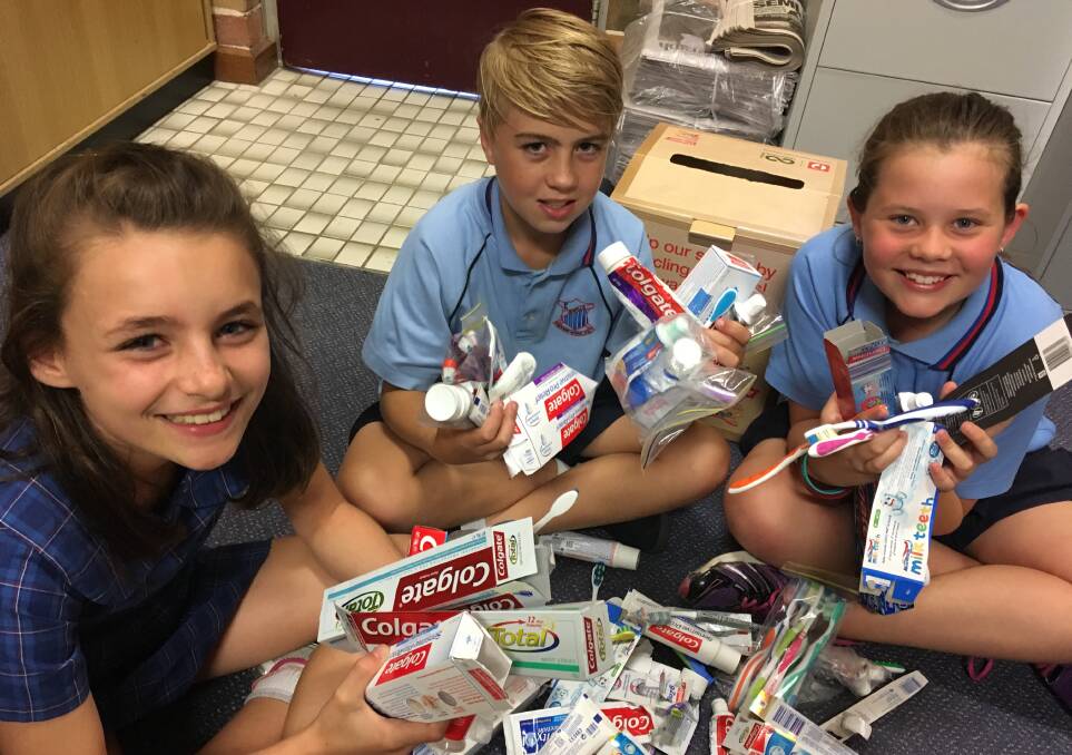 LEADING THE WAY: Jewells Primary School students Ava Dotta, Josh Sendjirdjan and Summer Russel with some of the oral waste collected this year.