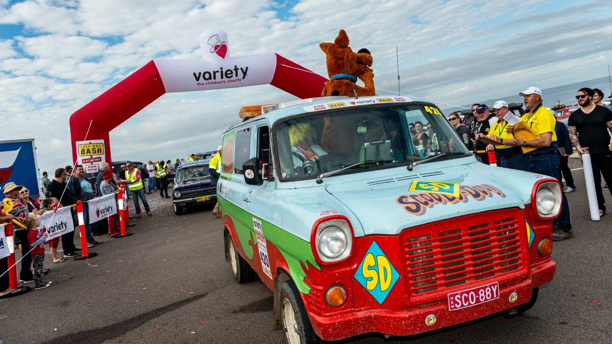 GOOD CAUSE: Eighty cars set off on from Bar Beach on Sunday for the NSW AHA Variety Bash. Picture: Alison Buckland
