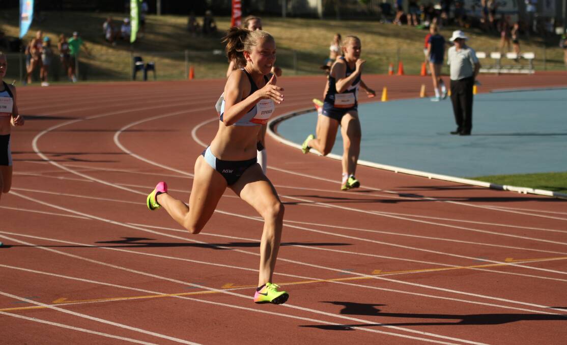 FAST: Merewether High's Milly Stephenson shows some strong form in the heats of the under-14 girls' 200 metres this week. Picture: David Tarbotton