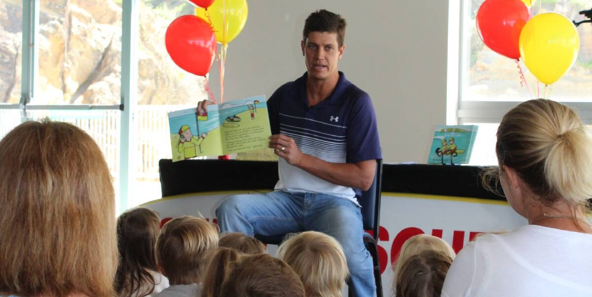 SAFETY MESSAGE: Boyd Conrick reads his book At The Beach with Lizzie and Luke to a group of Redhead Community Preschool children last week.