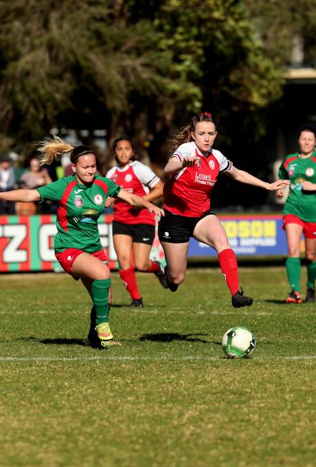 TOUGH BATTLE: Rhali Dobson goes on the attack as Merewether take a 2-1 lead in their Herald Women's Premier League semi-final with Adamstown. Picture: Simone De Peak