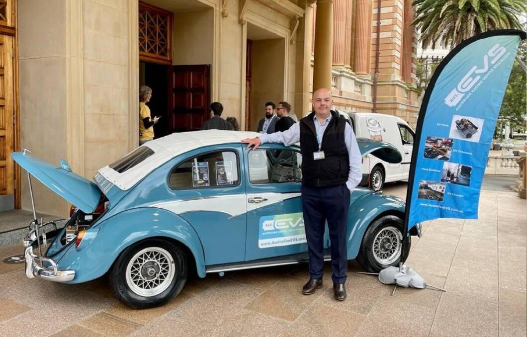 Australian EVS founder and director Edwin Higginson with the company's converted Volkswagen Beetle.