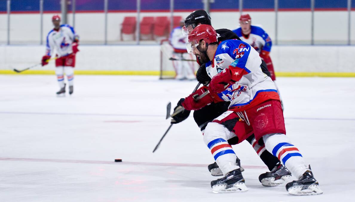 ON THE FLY: Newcastle North Stars player Matt Wetini battles for the puck in the April 6 Wilson Cup clash with the Sydney Bears at Hunter Ice Skating Stadium. Picture: Mark Bradford