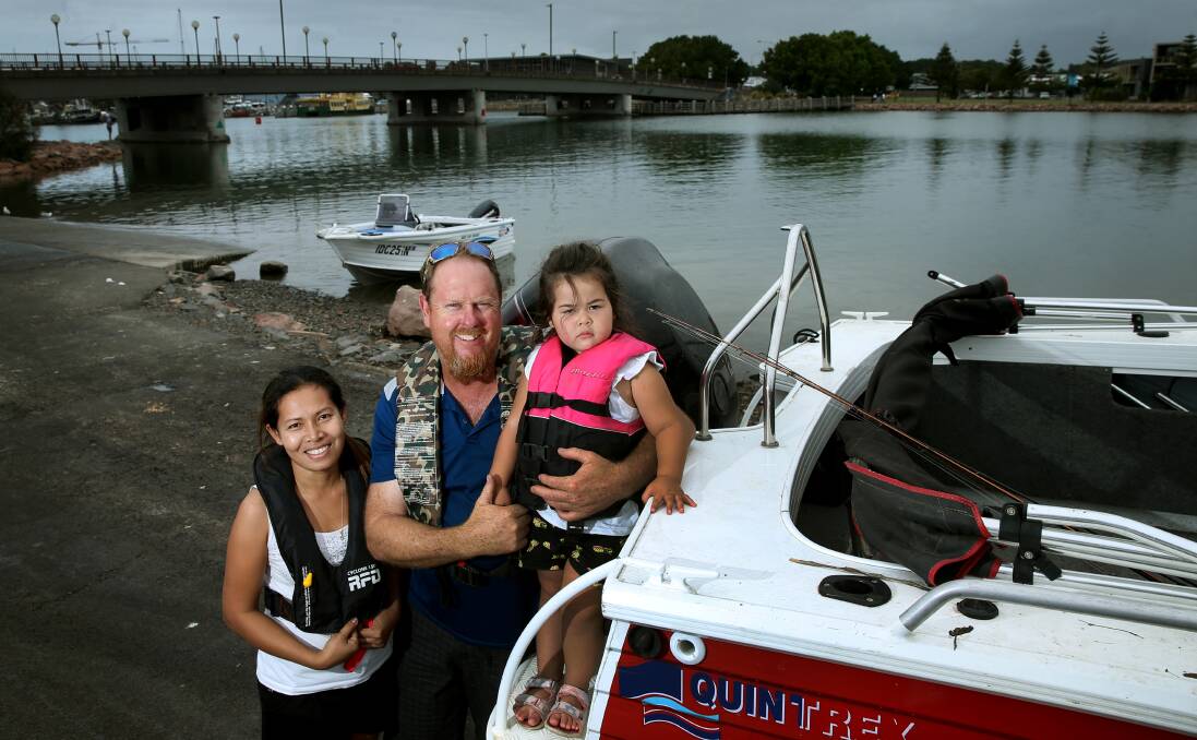BUOYANT: Boat owner Mark Wenban, with his partner, Anna, and daughter, Tanika, at Carrington boat ramp and in their lifejackets, because "that's the safest thing you can do". Picture: Marina Neil